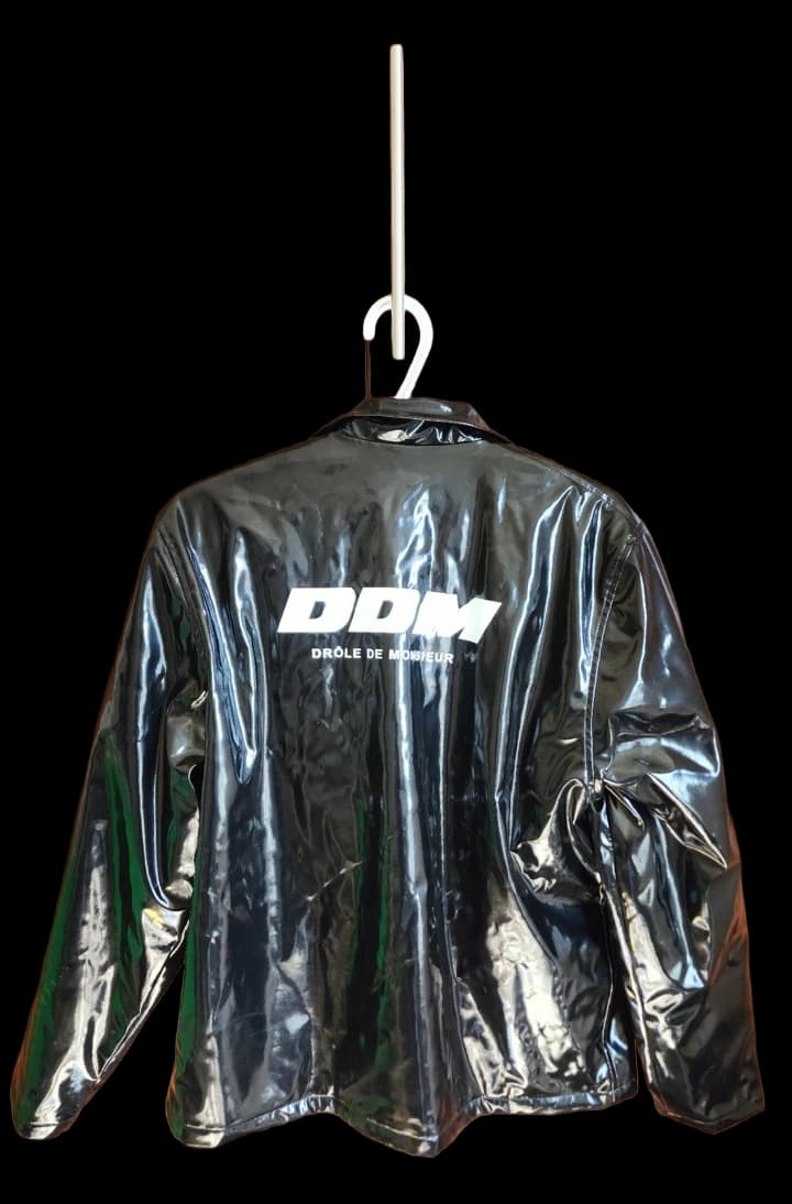 Glossy black Drôle de Monsieur jacket with a white back logo
