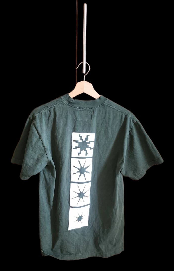Dark green T-shirt with four white graphic panels on the back