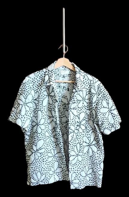 White short-sleeve shirt with a dark geometric print